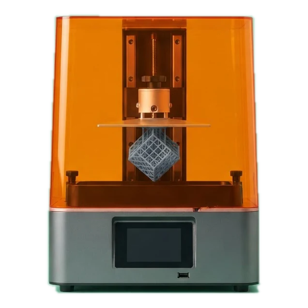 A resin 3D printer with an orange cover on a mint backdrop